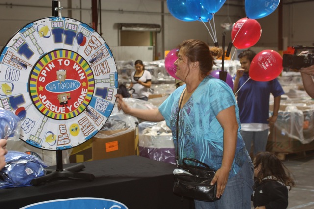 Spin the wheel A lucky winner spinning the wheel for her free gift!